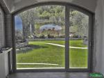 Lavori di installazione infissi in PVC ad Arco con finestra e portafinestra a battente
