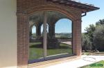 Lavori di installazione infissi in PVC ad Arco con finestra e portafinestra a battente