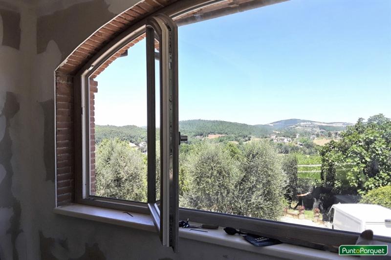 Lavori di installazione infissi in PVC ad Arco con finestra e portafinestra a battente